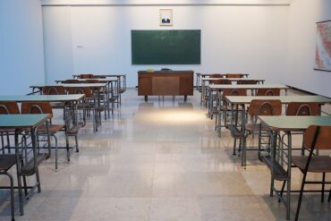 Modern school building with students and educational facilities