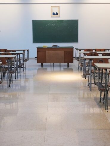 Modern school building with students and educational facilities