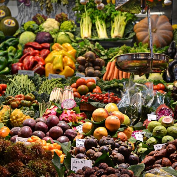 Fresh produce and vegetables displayed at an outdoor farmers market