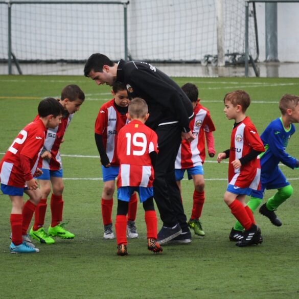 Youth soccer players on a field during a community sports event