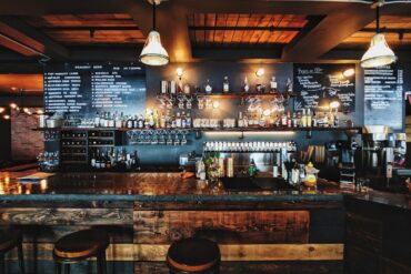 Cozy restaurant interior with warm lighting and rustic decor